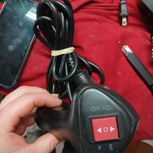 Black Electronic Device with Red Button